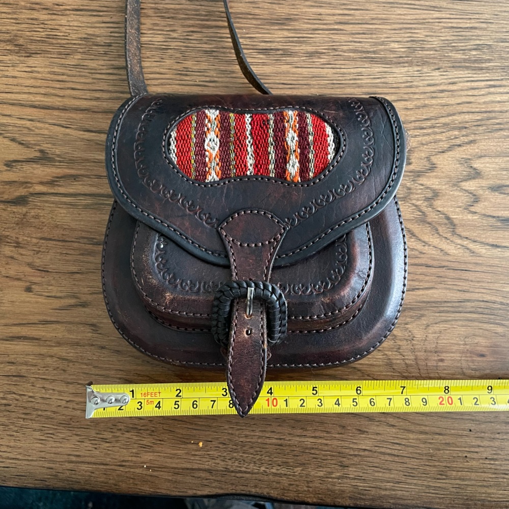 Distressed leather purse with western style accents